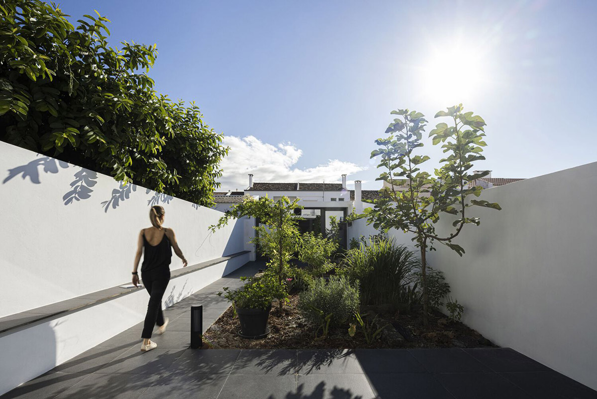 BOX arquitectos designs all-white narrow urban house featuring large terrace in Ponta Delgado 