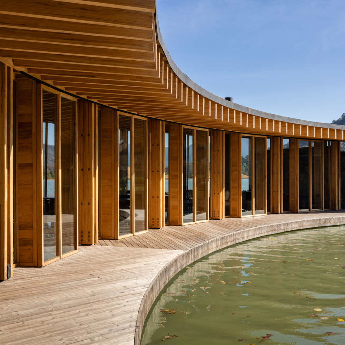 Circular clubhouse by Sordo Madaleno Arquitectos is nestled on the edge of lake in Valle de Bravo