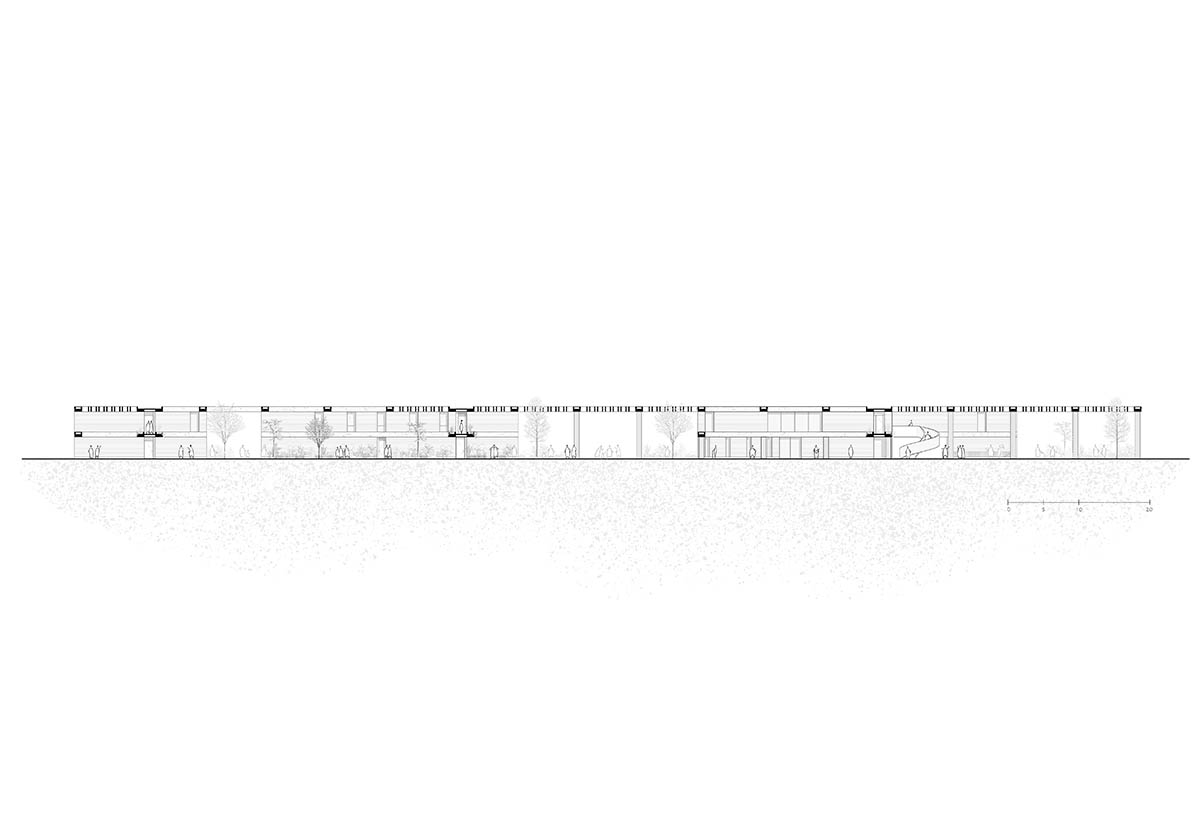 Red pigmented gridded structure defines village-like Mexican sport facility by Sordo Madaleno