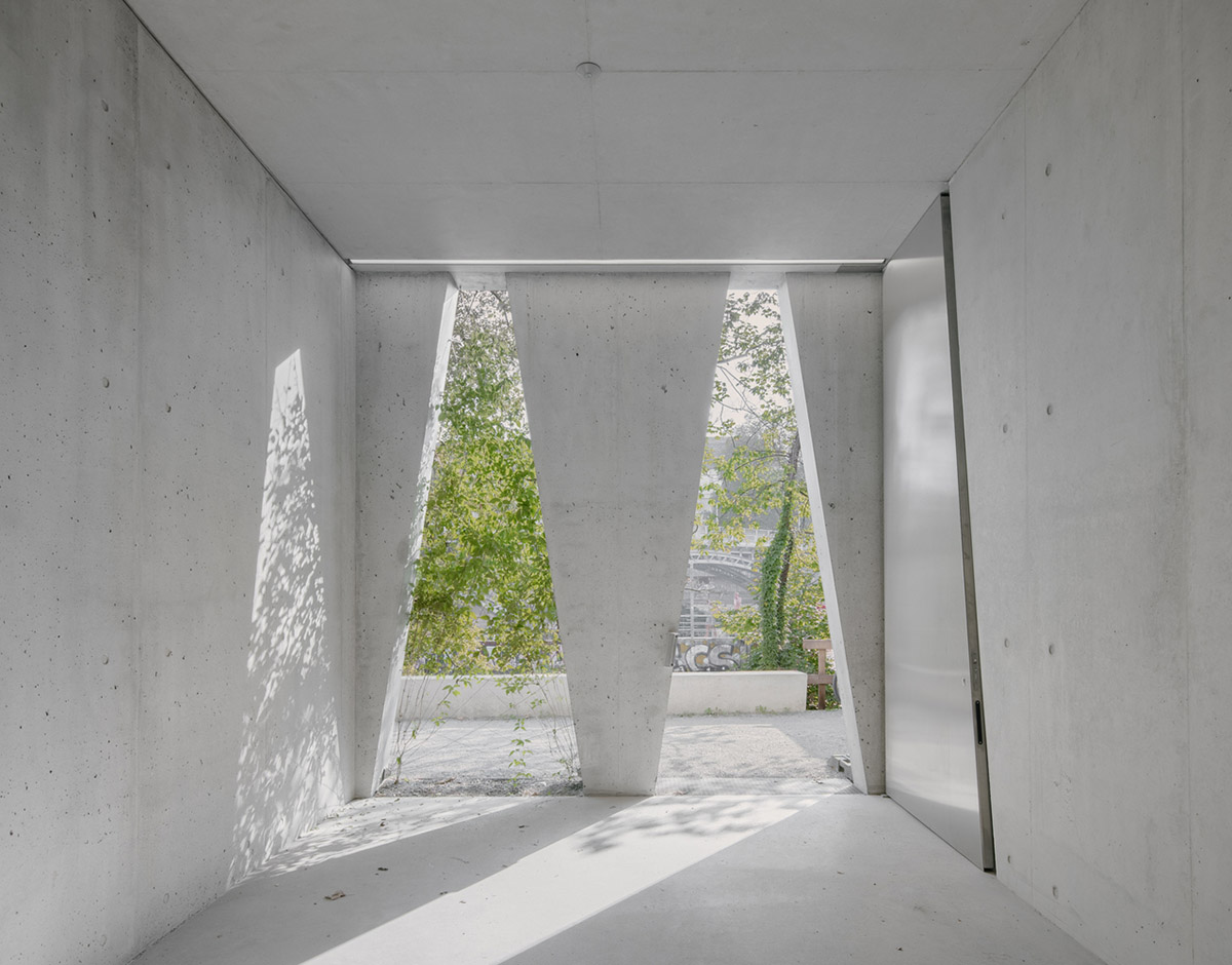 Trapezoidal openings characterize the interiors of cultural center by Estudio Barozzi Veiga in Zürich