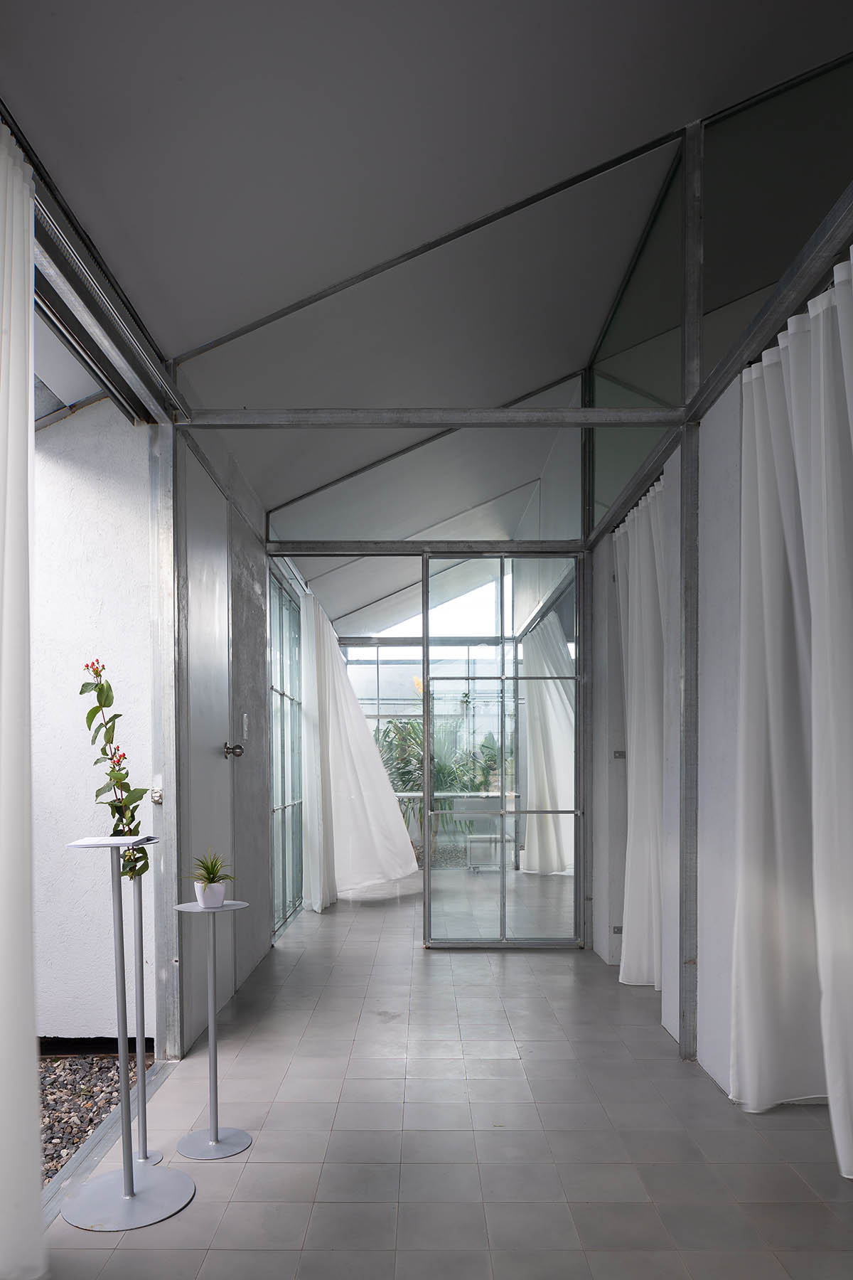 MIA Design Studio completes family house with angular roof in Vietnam 