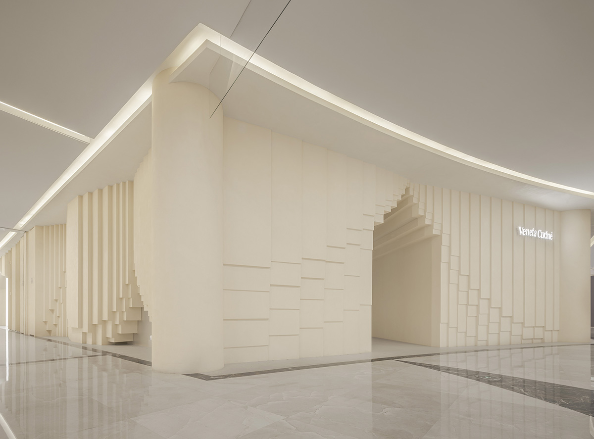 Simple Cuisine Gallery mimics waterfalls, with flowing facades that evoke water movement in China 