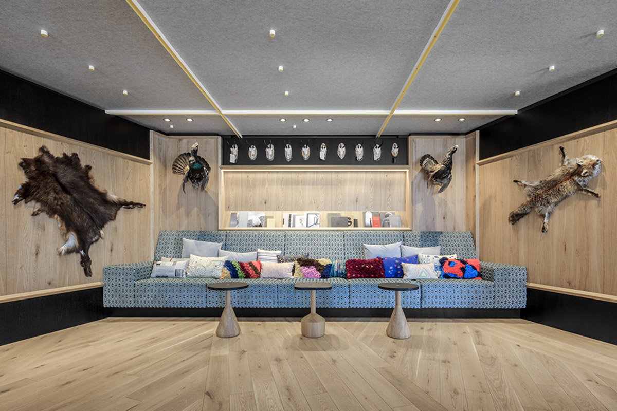 Icaro Hotel featuring wooden colonnade frames embraces alpine heritage landscape in Italy 