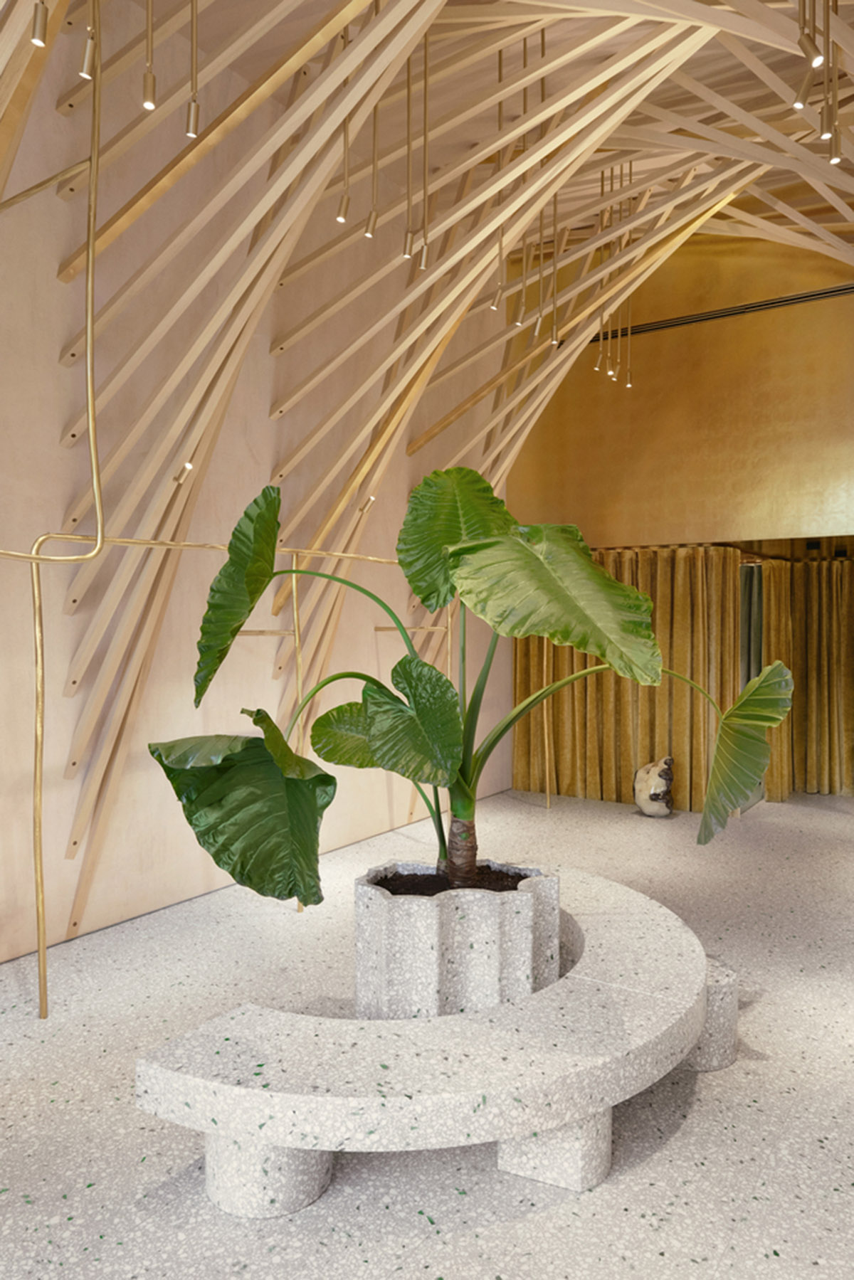 Golden and powder-colored details dominate forte_forte forte dei Marmi boutique in Italy