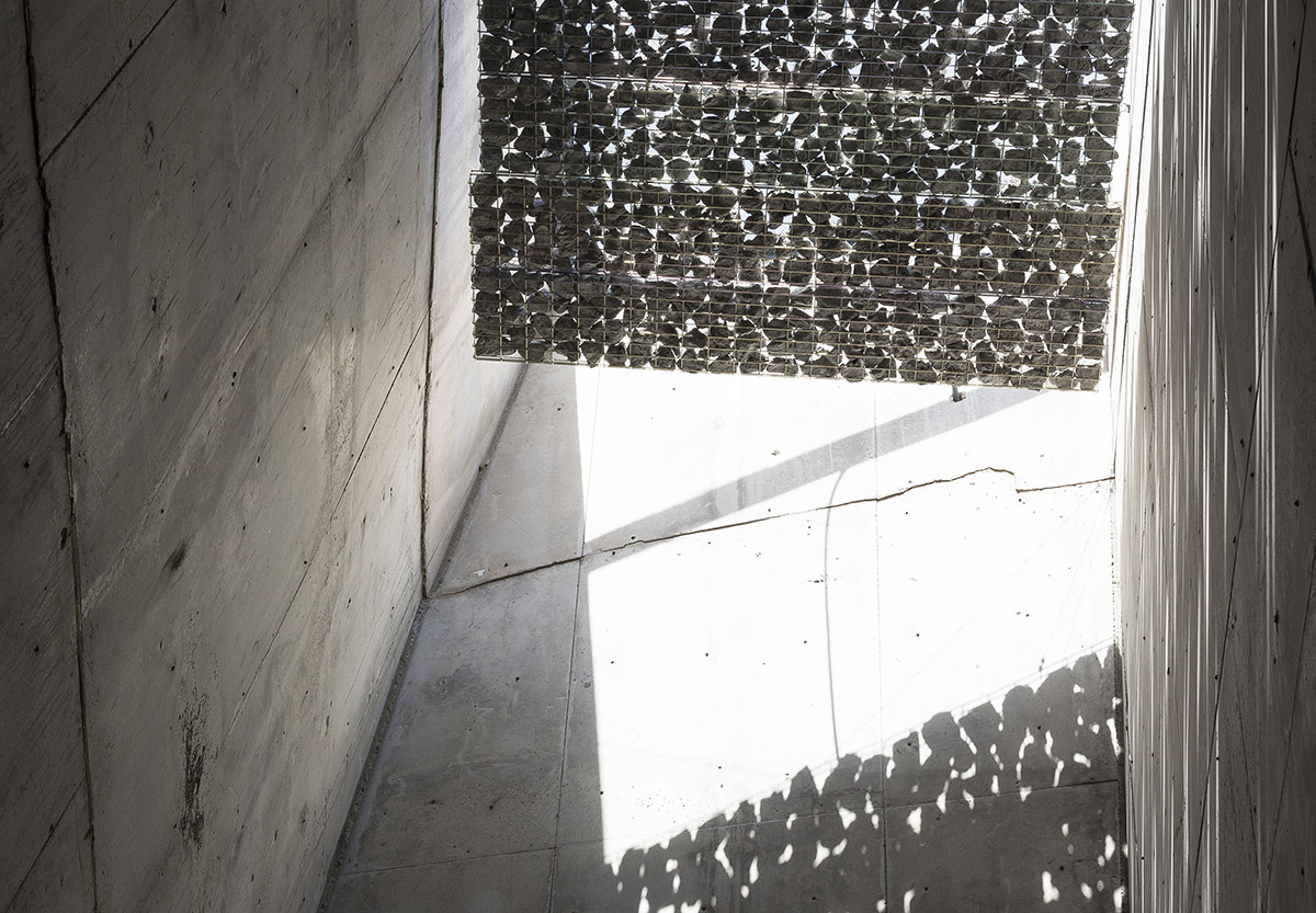 Menis Arquitectos designs church and community centre in Spain with four massive concrete volumes 