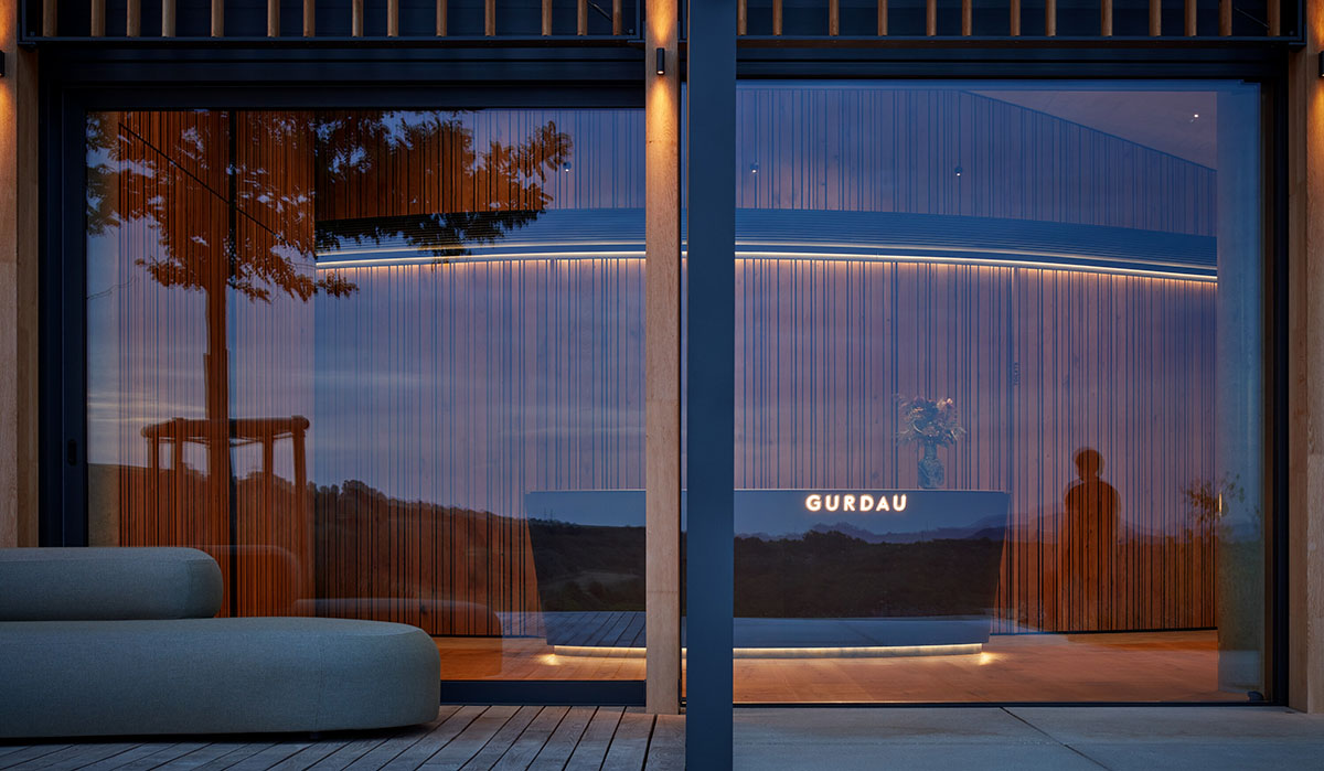 Curved green roof hides winery by Aleš Fiala in a rolling landscape in the Czech Republic