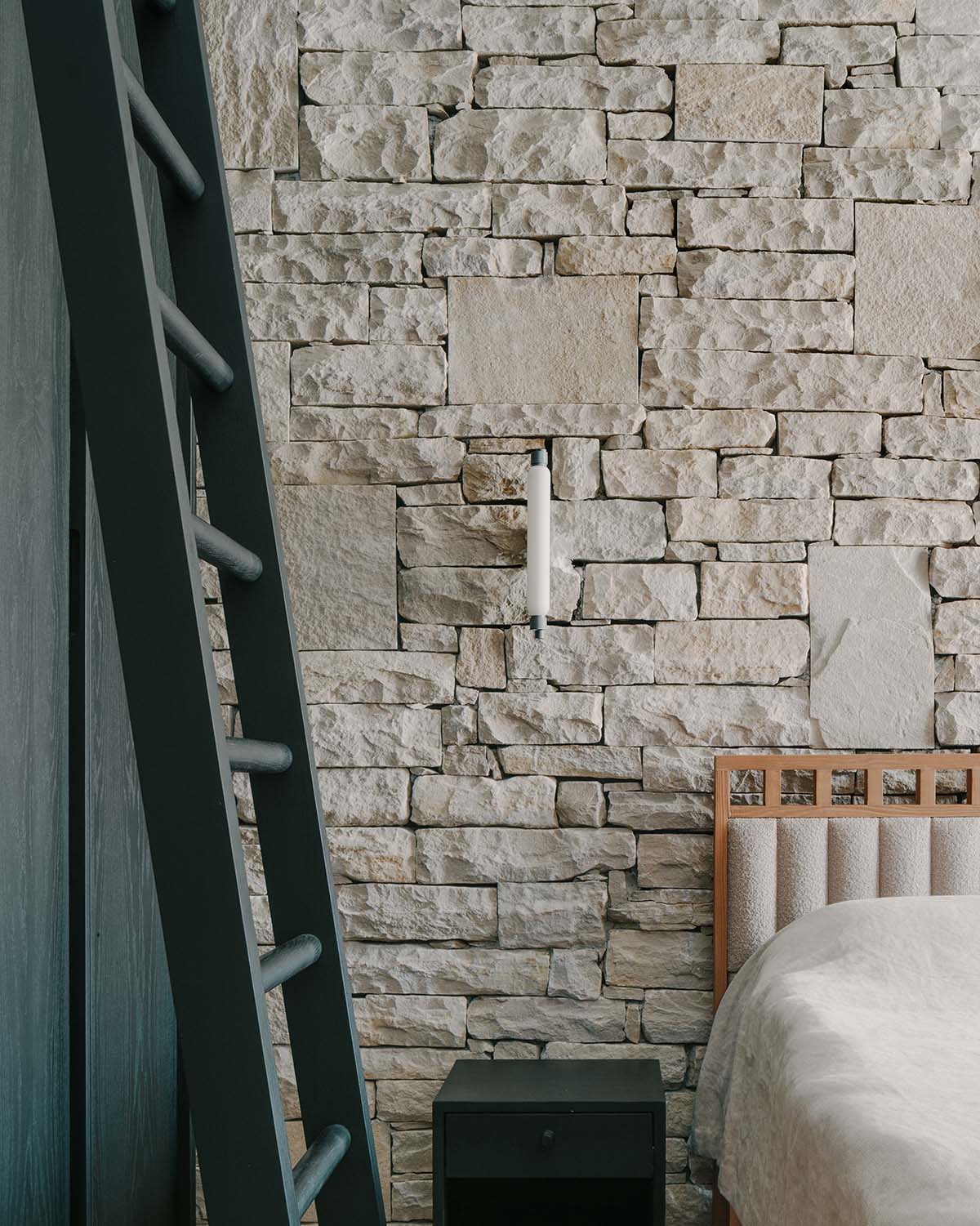 The stone and wood Tbilisi residence integrates architecture with the natural landscape