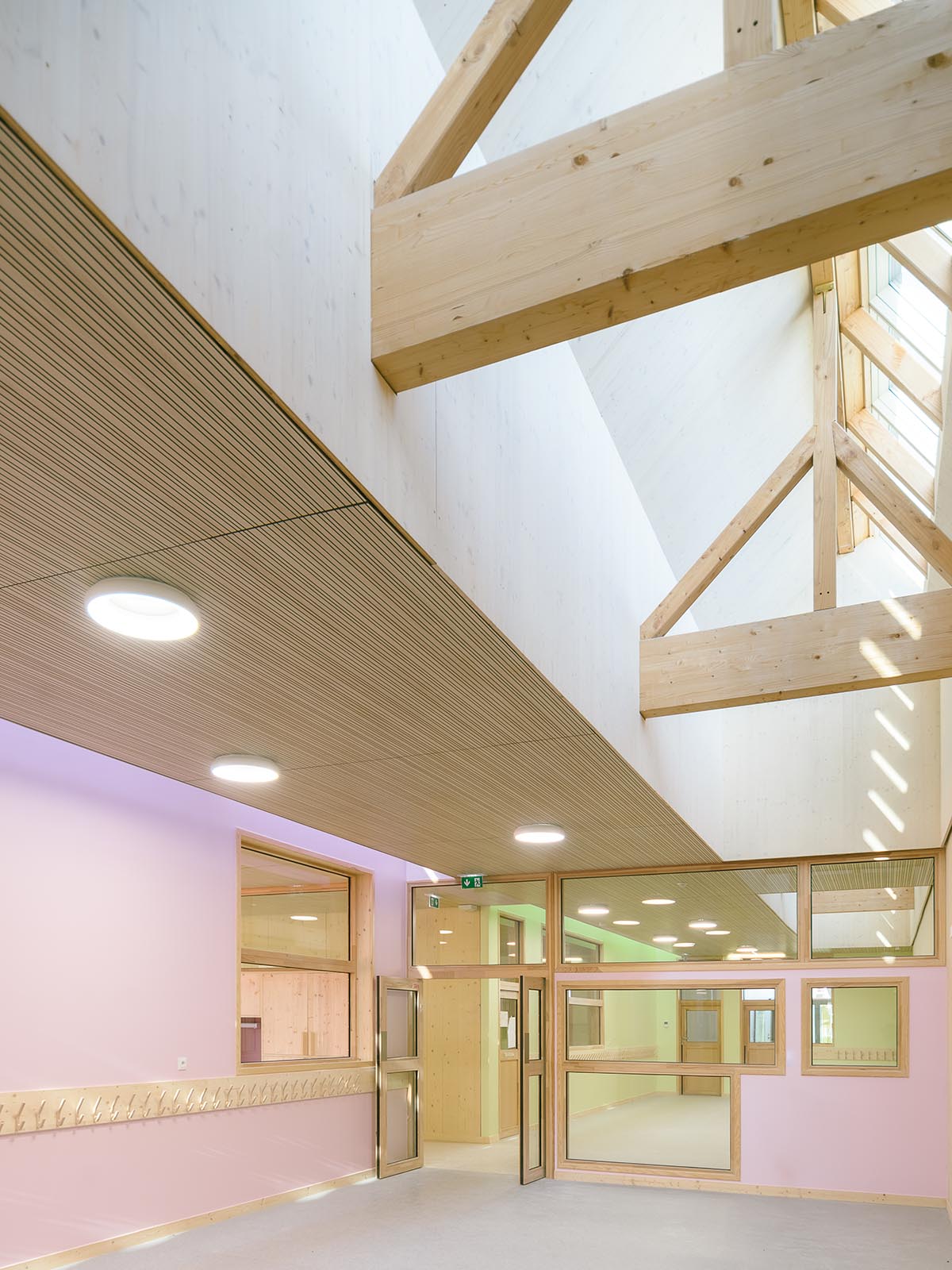 Wooden school by r2k architecte is inspired by Nordic architecture to be a positive energy building