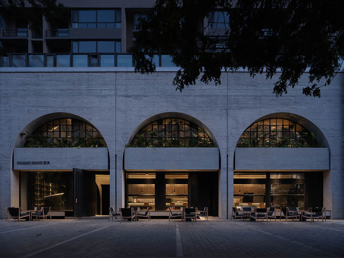 Large triple-arched windows enhance the iconic presence of the concrete Whisky Bar in Taiyuan, China
