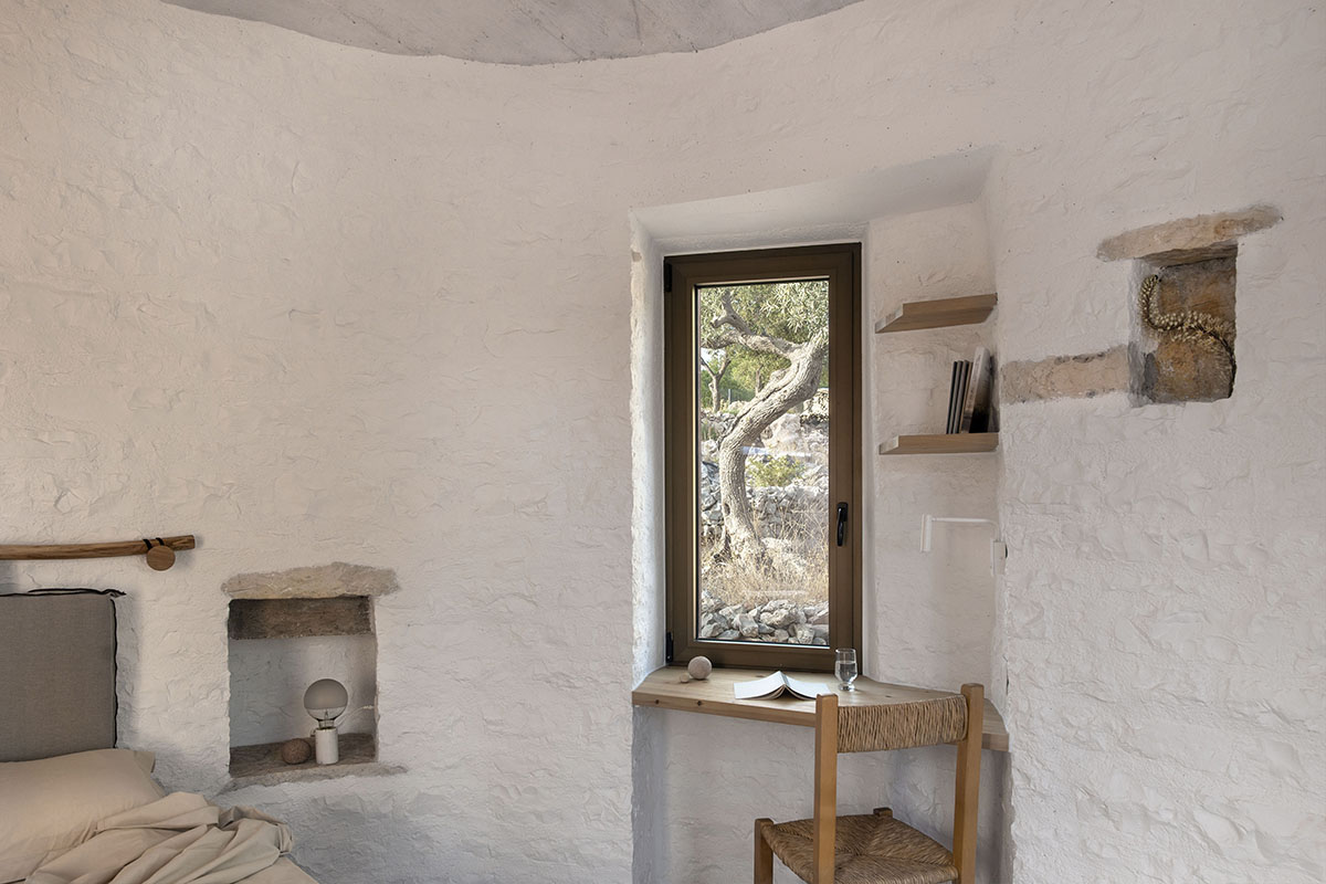 Pastoral round stone dwellings inform Meganisi House by Hiboux Architecture on Meganisi island