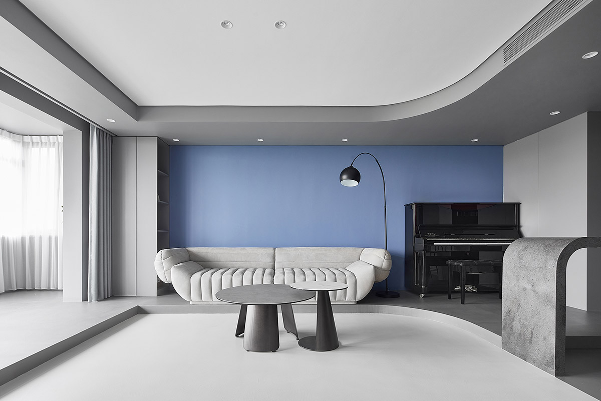 XIGO STUDIO creates gray and blue-colored interiors for apartment in Beijing 