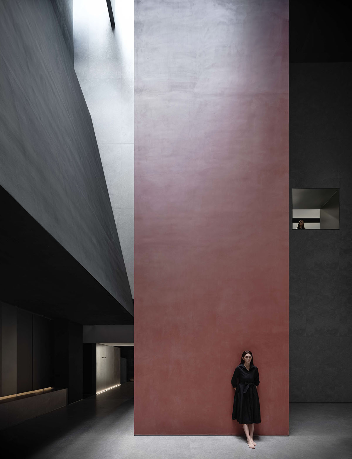 AD ARCHITECTURE creates dark interiors for showroom playing with light and sharp geometries in Foshan