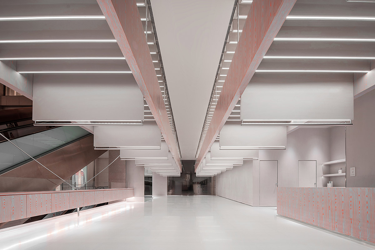 Various Associates creates show-like and pink-hued fashion store under a viaduct in Chongqing