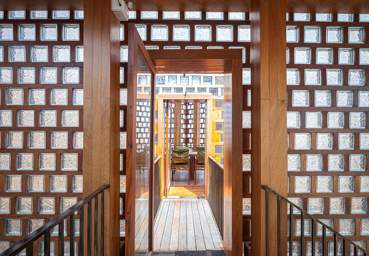 Five glass blocks with framed wood form this woman restaurant designed by Bangkok Project Studio