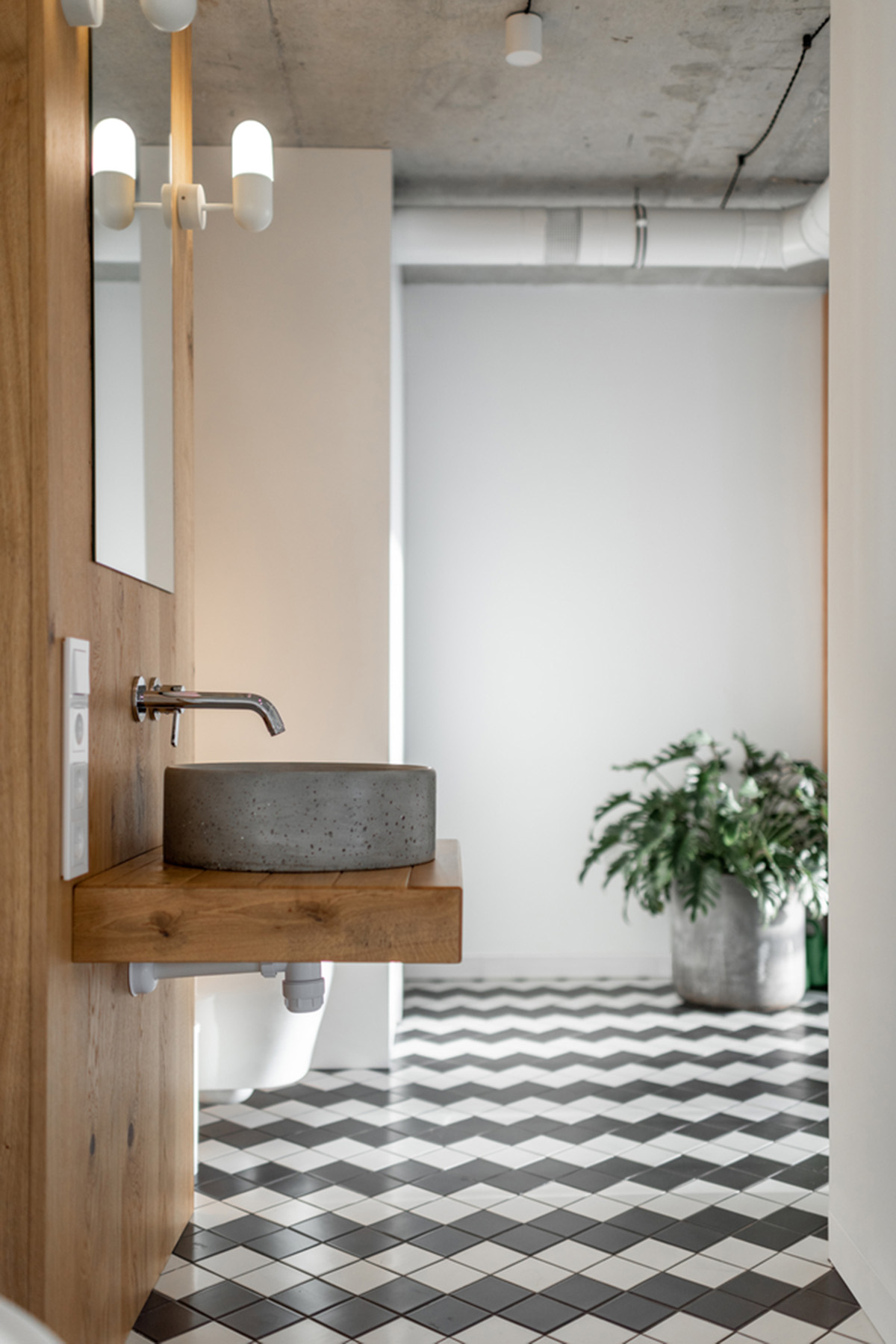 Metal framed-table, glass partitions, green infills make this interior space vivid and light in Lviv