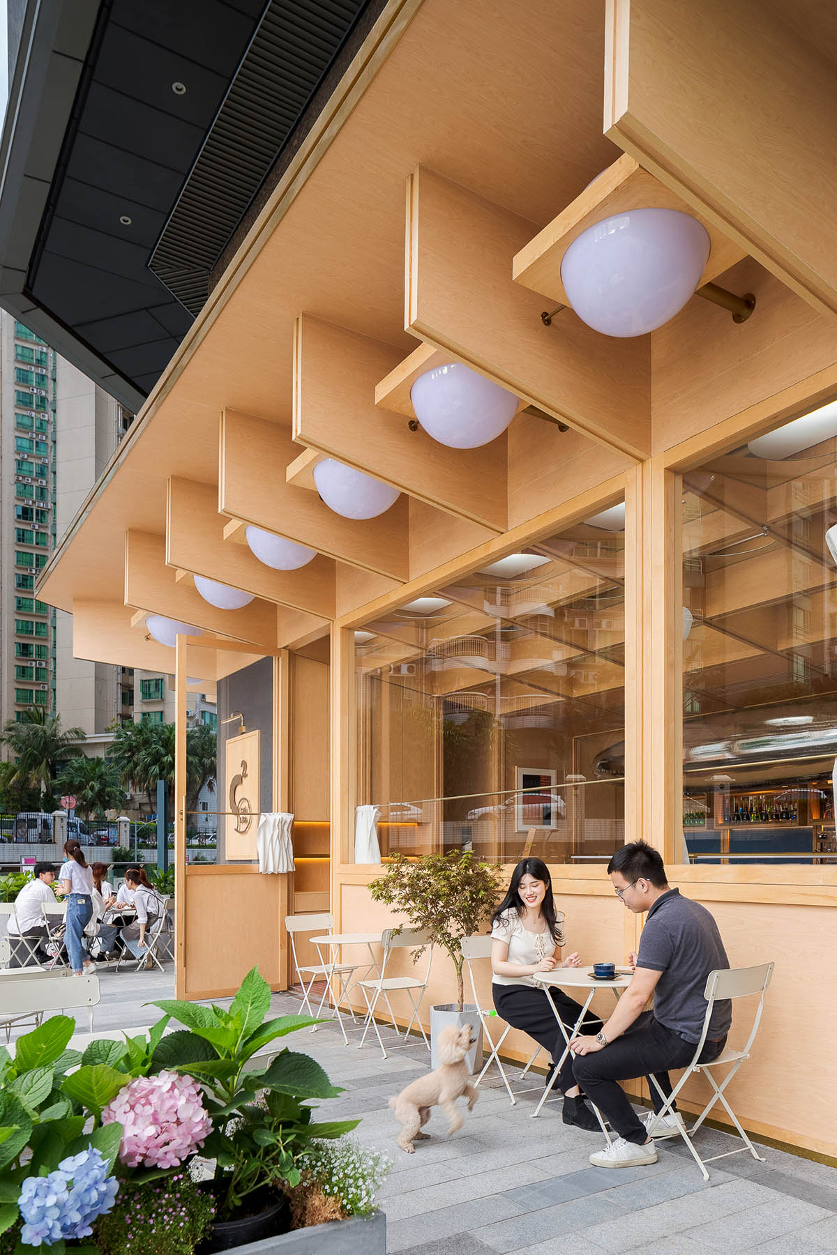 Various Associates completes C² Cafe & Bar in Shenzhen with wooden ceiling details