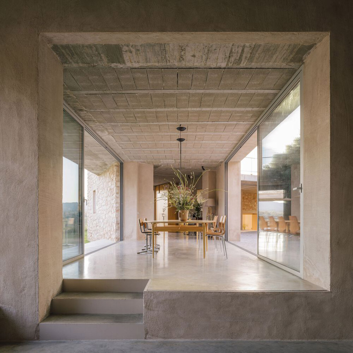 Villa Icaria House features bridge-like volumes focusing on permeability on a hilly terrain of Spain