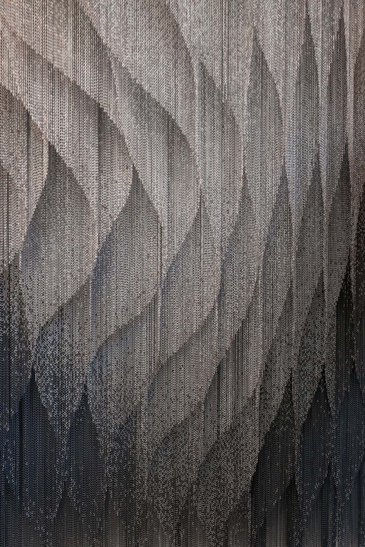 Kengo Kuma and Associates designs metal curtain with shades of grey at the atrium of Casa Batlló