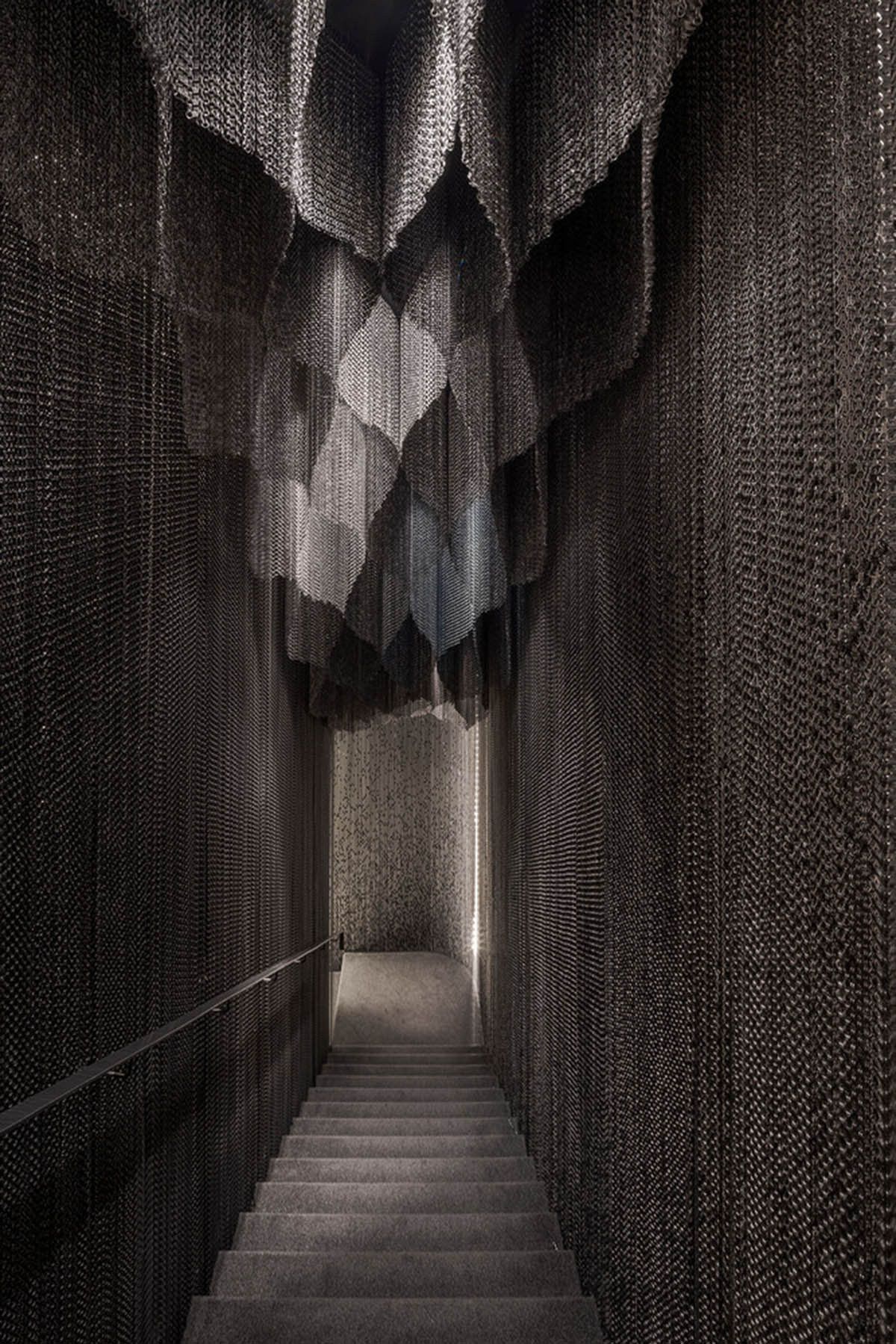 Kengo Kuma and Associates designs metal curtain with shades of grey at the atrium of Casa Batlló