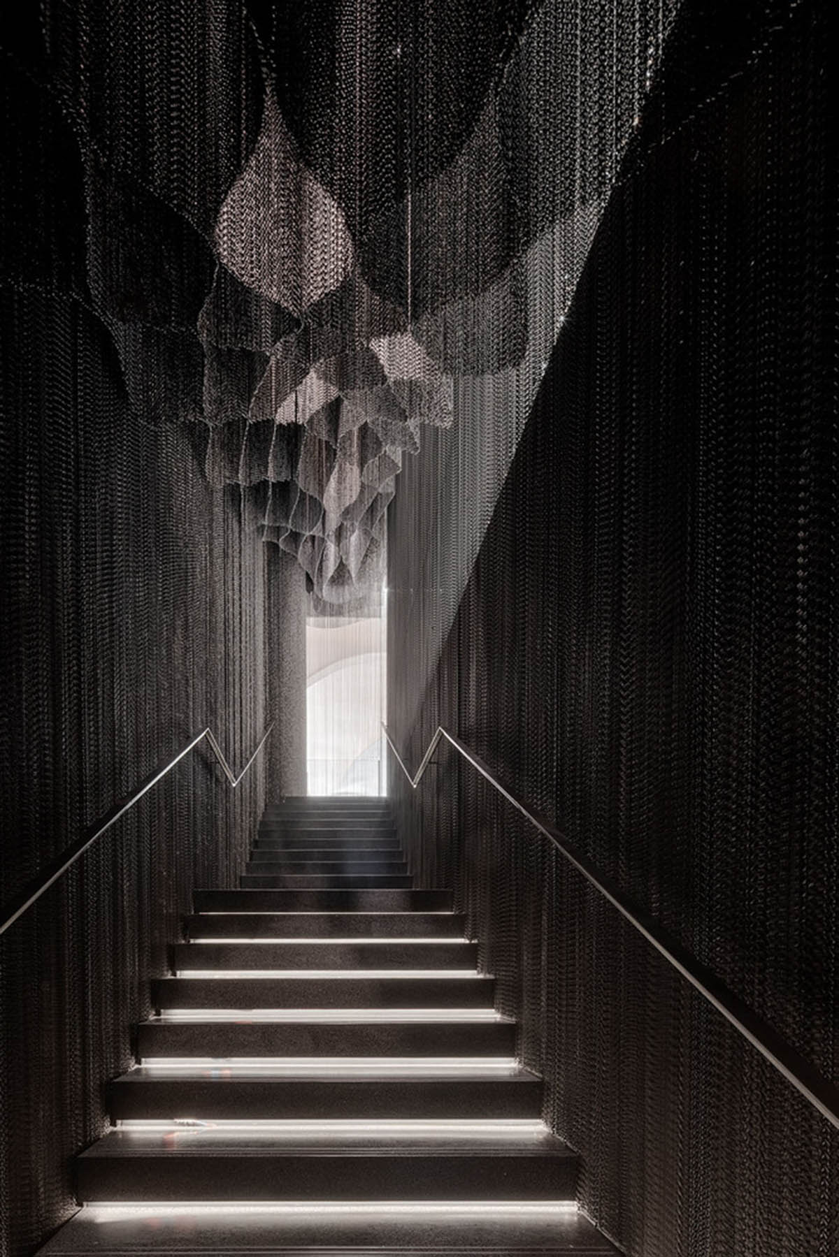 Kengo Kuma and Associates designs metal curtain with shades of grey at the atrium of Casa Batlló