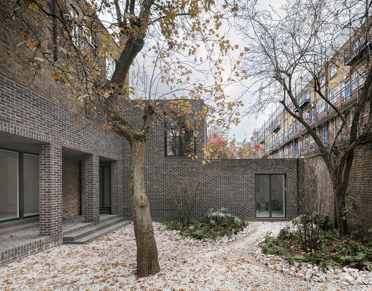 Erbar Mattes converts old pub into apartments in handmade grey-brown bricks in London 