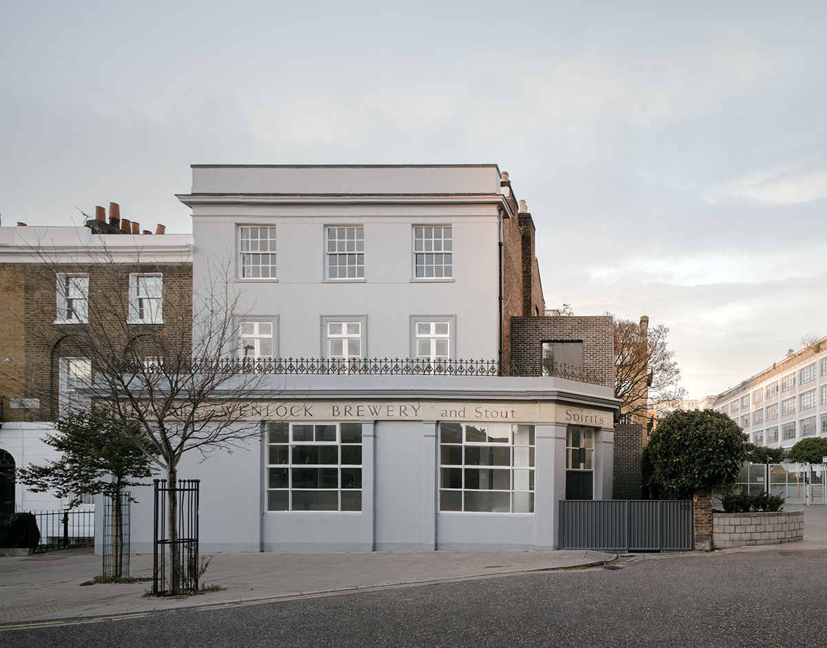 Erbar Mattes converts old pub into apartments in handmade grey-brown bricks in London 