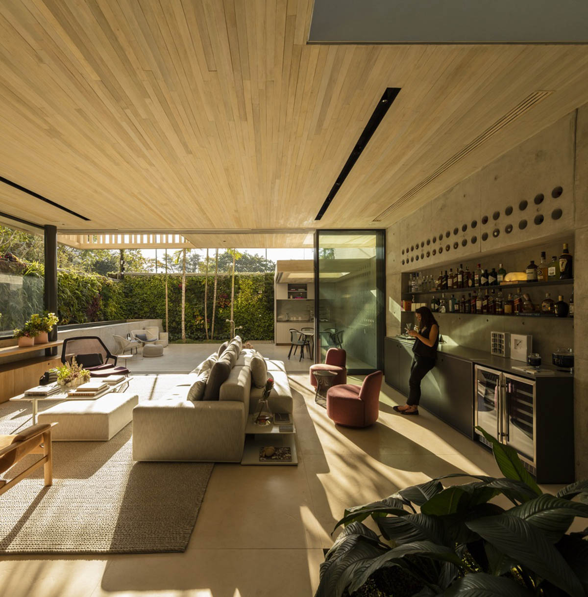Studio AG designed large wooden residence featuring punctured volumes with gabled roof in São Paulo