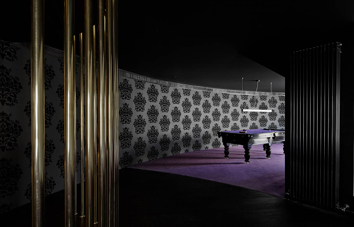 Wood Marsh built curvaceous home clad in dark timber contrasting its natural landscape in Portsea