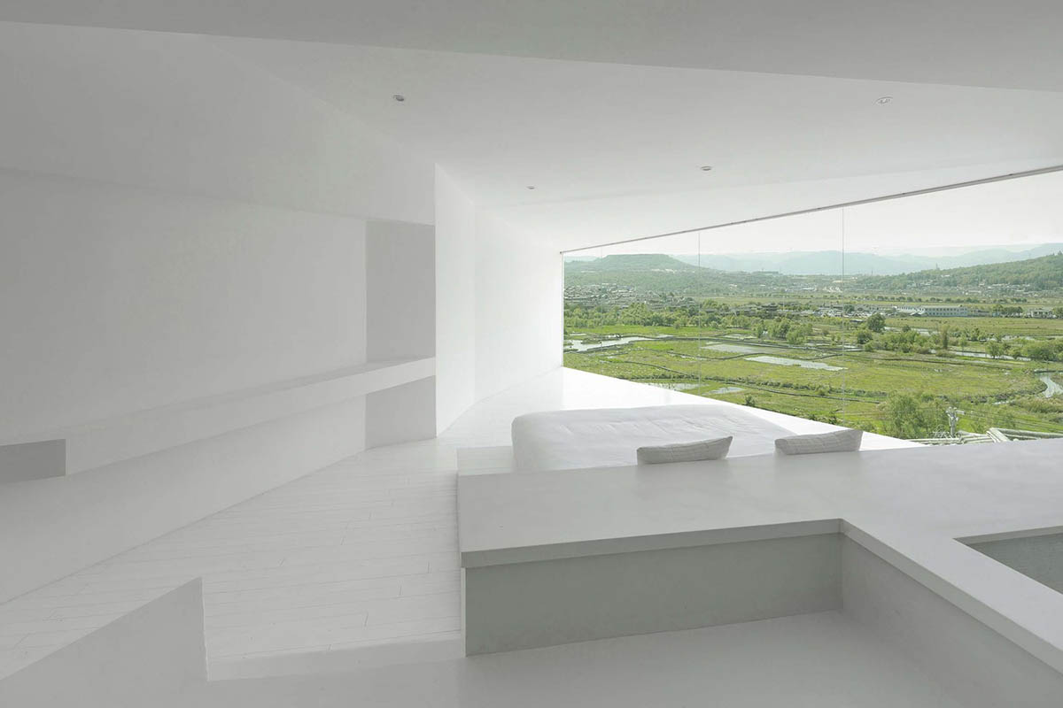 STUDIO QI reinterprets sequence of living conditions with tilted hotel on a hilly plot in China