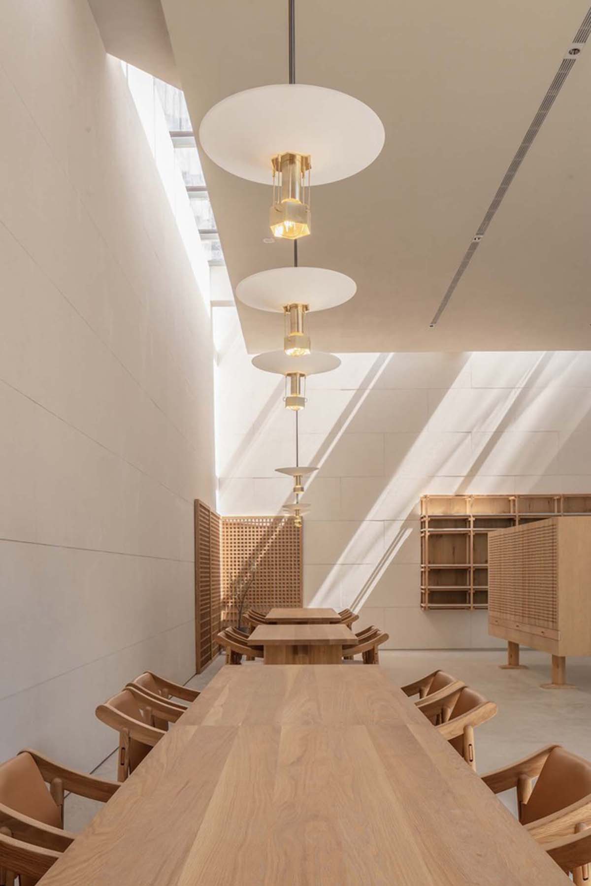 Waterfrom Design creates peaceful interior with wooden furnitures for tea community center in China