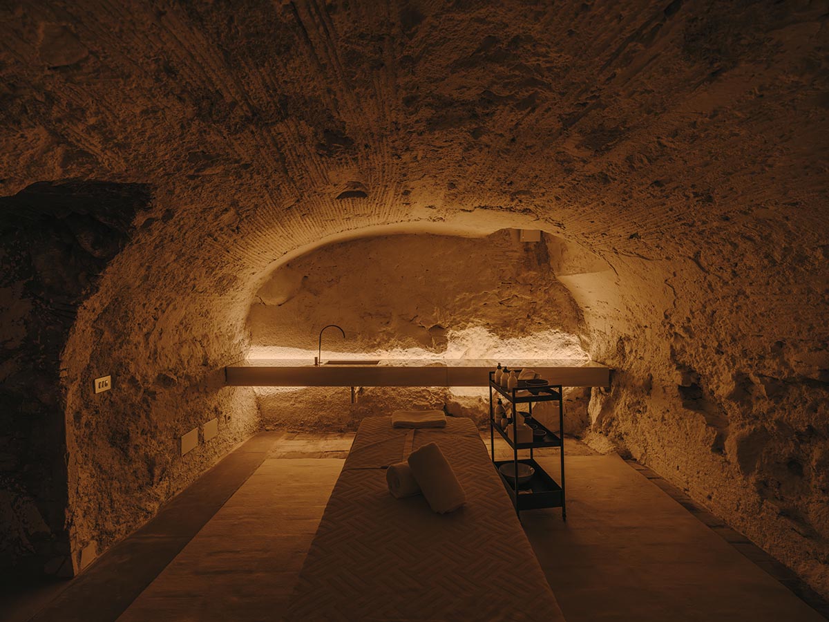 El Equipo Creativo converts 18th-century palace into hotel with rich textures and colors in Girona