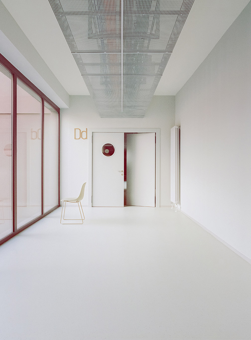 BDR bureau completes community school with pinkish steel framework in Turin