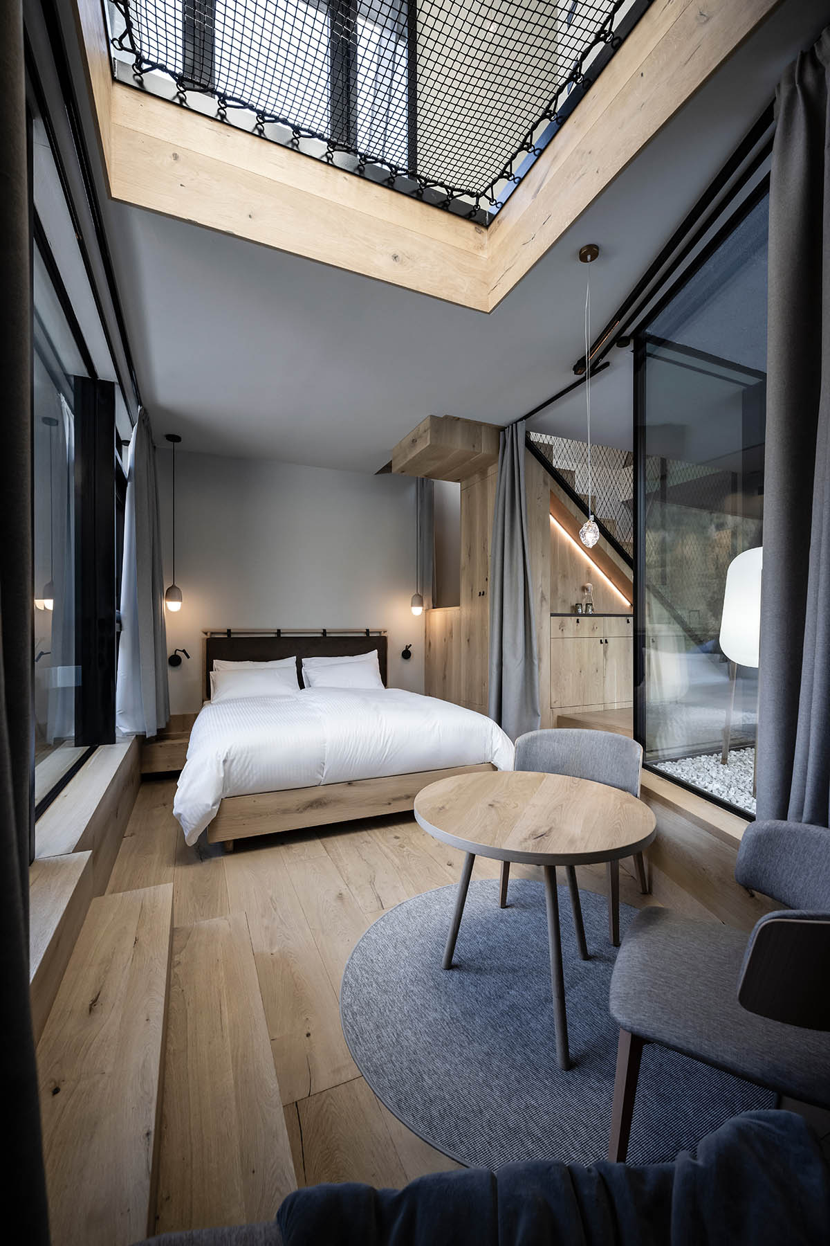 Zigzag roof defines character of Olympic Spa Hotel by NOA in the Alpine meadow