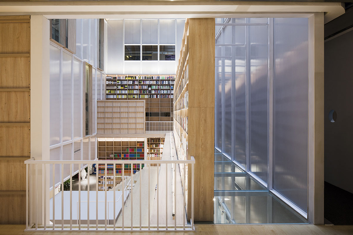 y.ad studio designs Yuanping Meijing Bookstore hidden in daylighting atriums in China