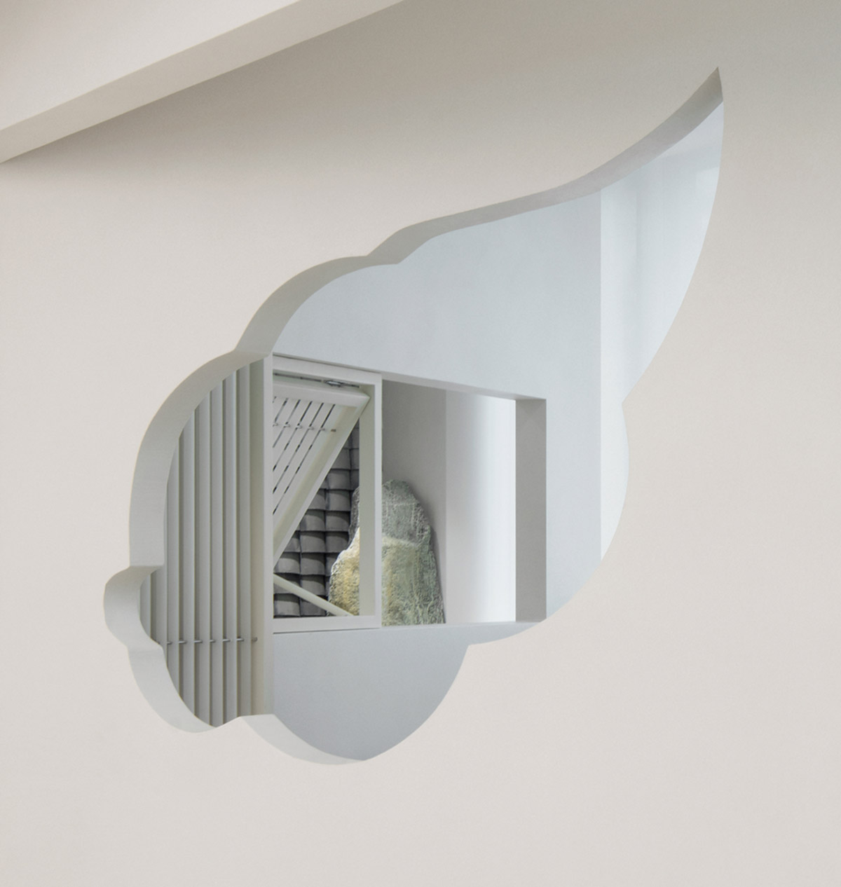 Jiejie studio wraps this tea room with a peach garden with rocky and forest landscape in Beijing