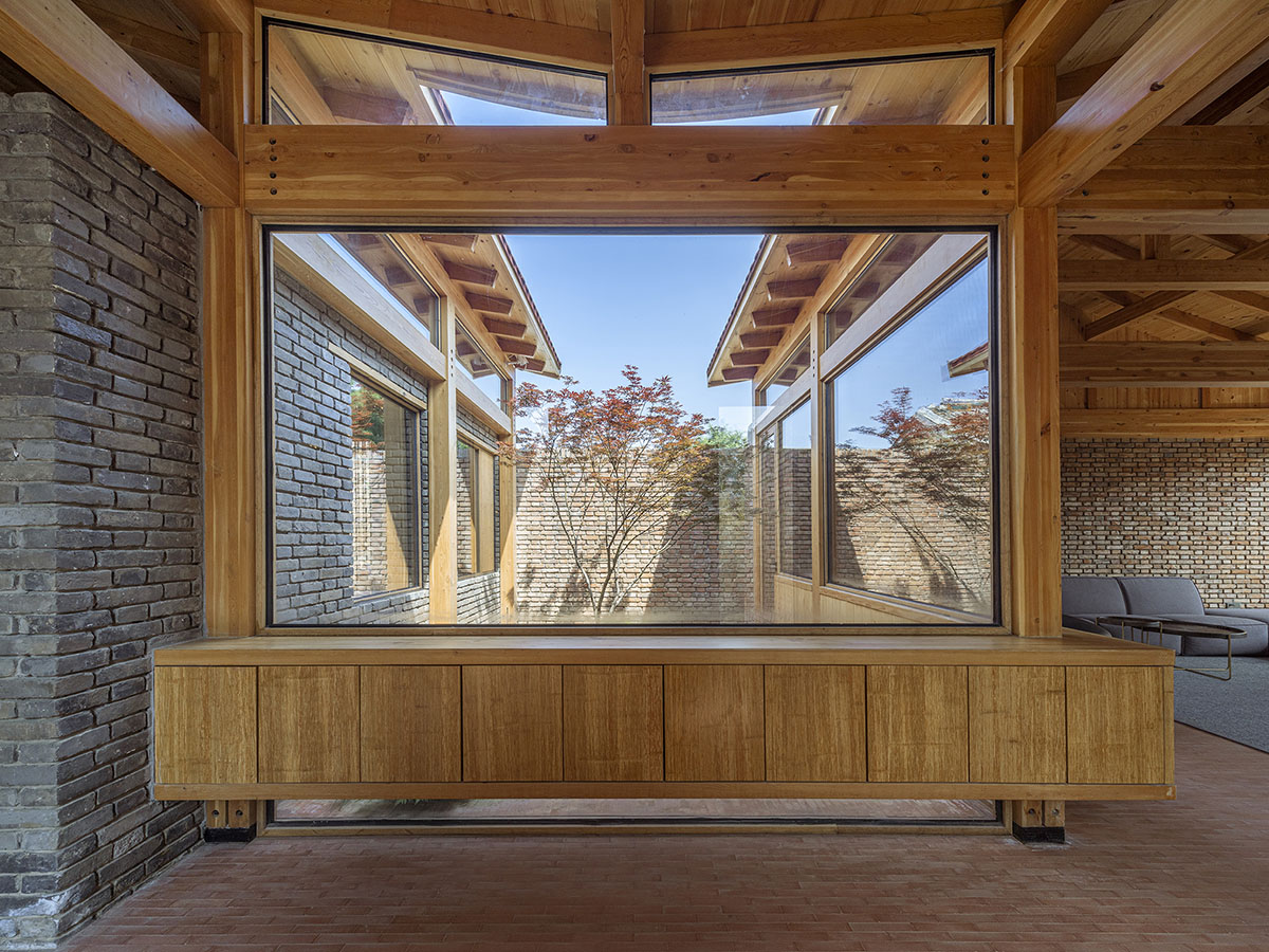 Archstudio renovates Beijing's old courtyard house with new wooden additions 