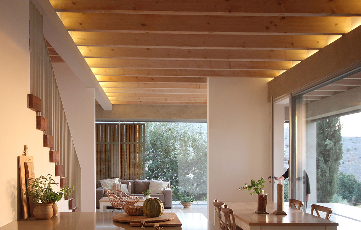 Golany Architects completes concrete private residence with wooden shutters in the Galilee