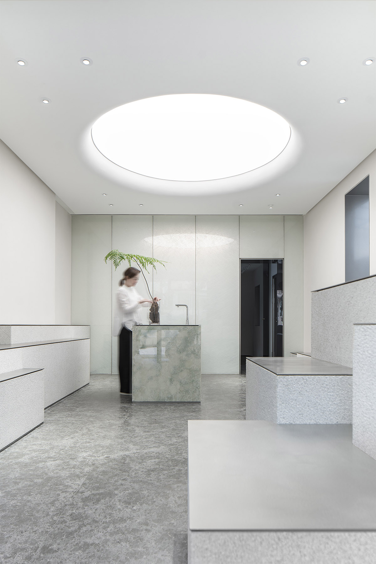 More Design Office's Absolute Flower Shop features cellular spaces with flower arrangements