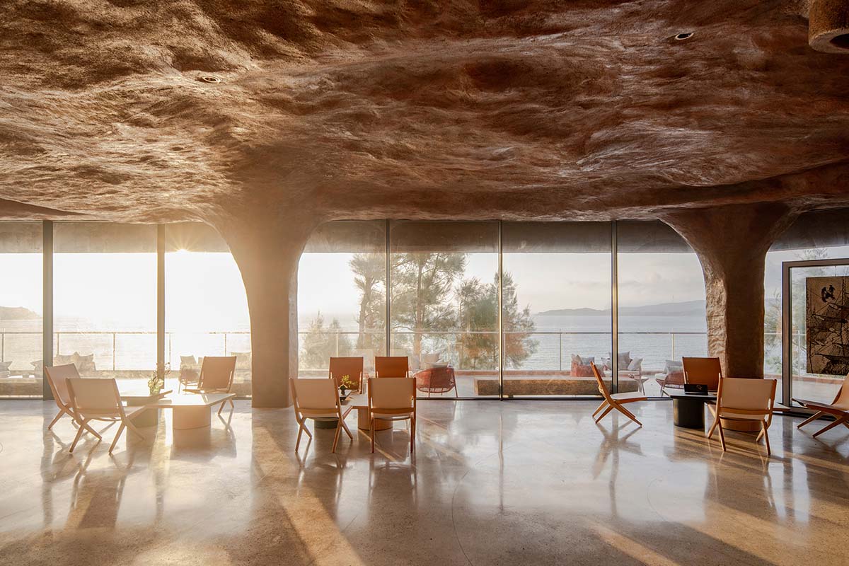 A gallery on a cliff features irregularly shaped lighting tubes that mimic marine creatures in China