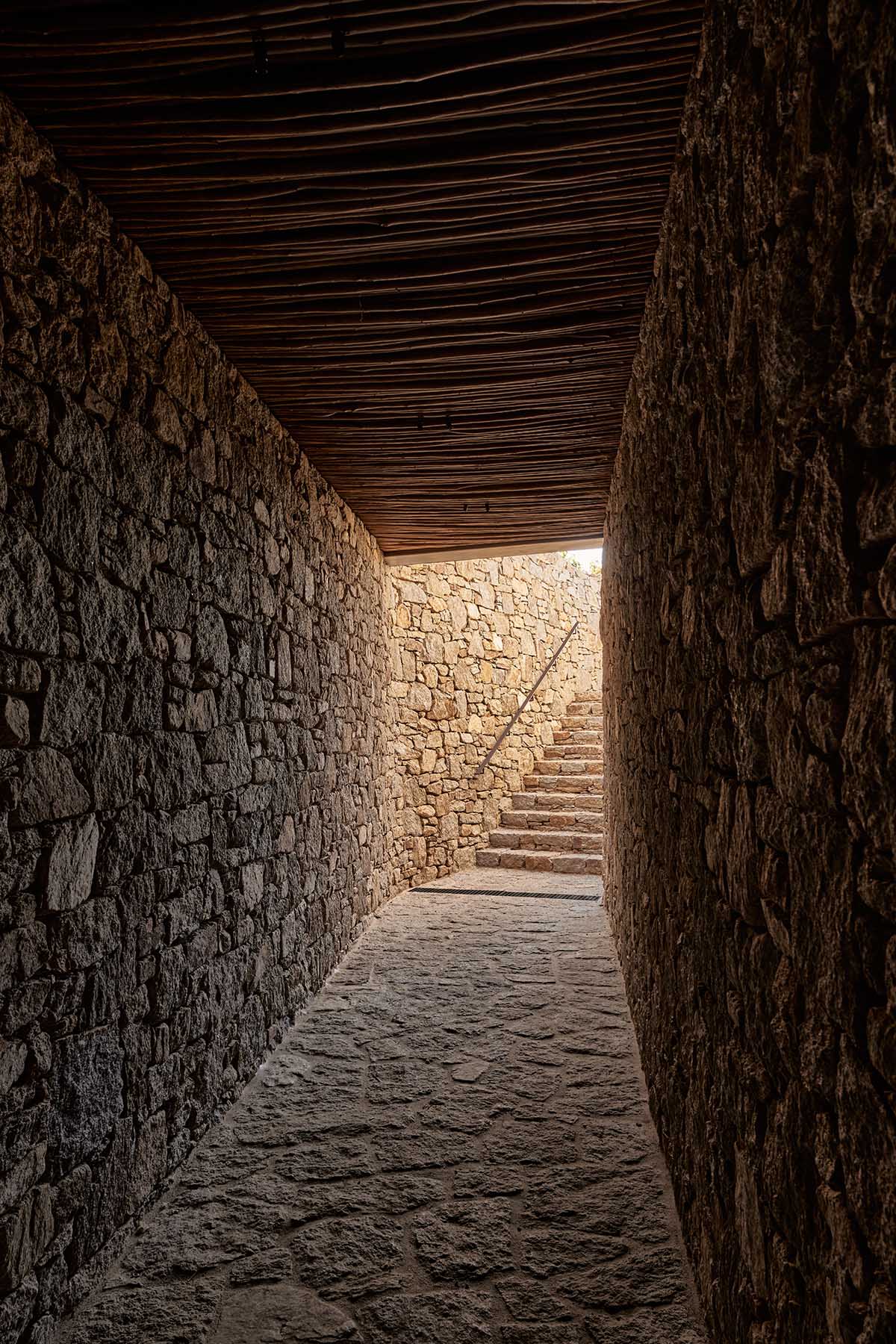 Terraced stonewalls sprawl down to offer an exploratory route in an old vineyard in Samos