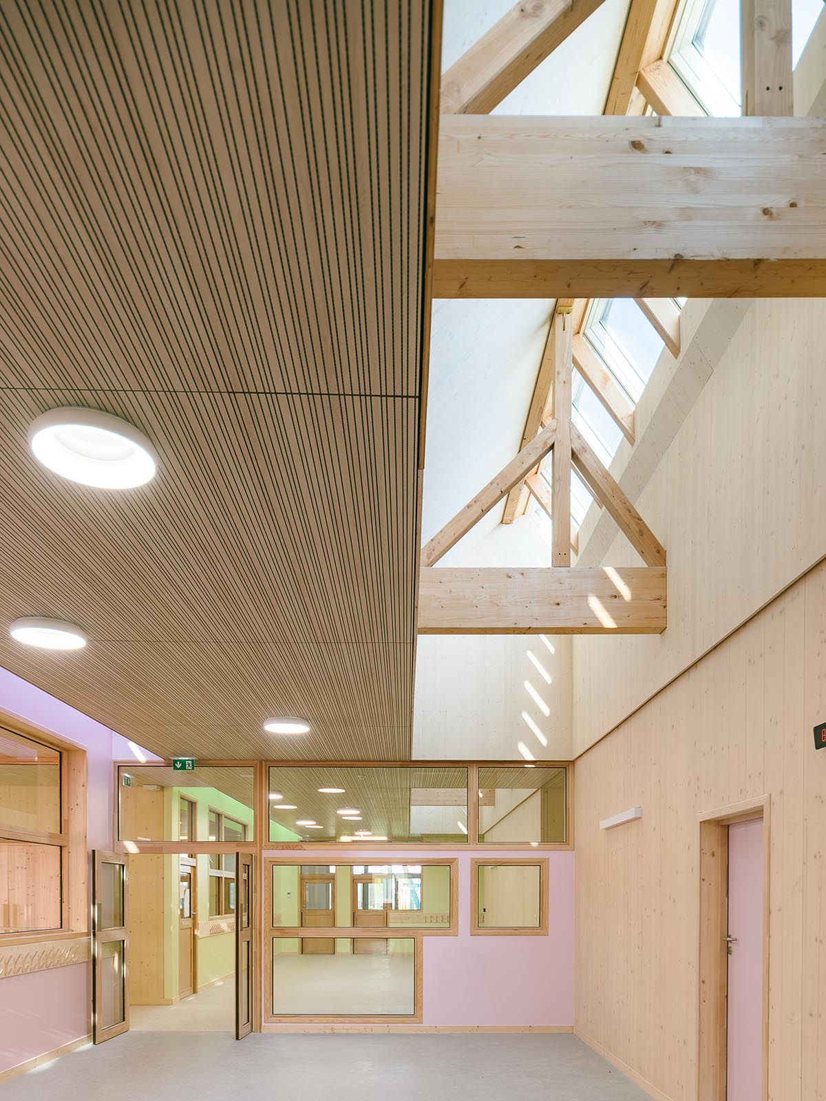 Wooden school by r2k architecte is inspired by Nordic architecture to be a positive energy building