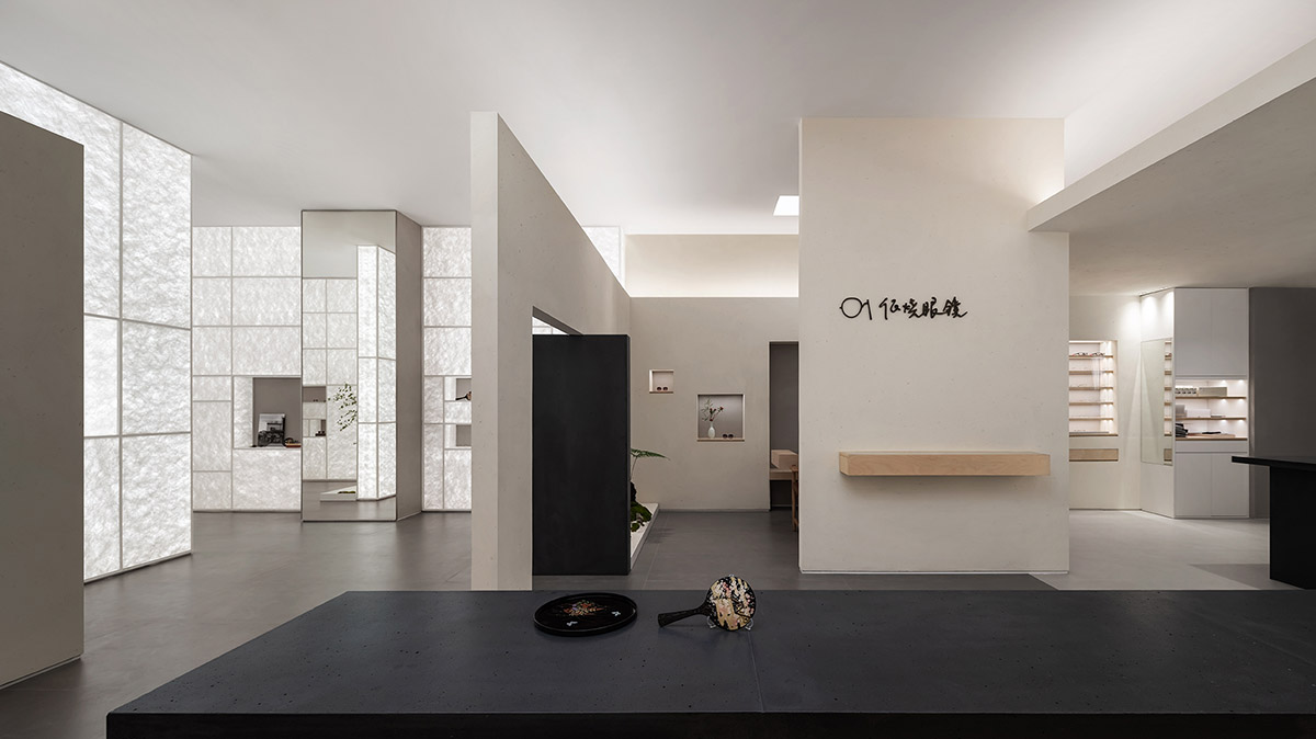 Luminous screen walls create fluid interiors for an optic store designed by Onexn Architects 