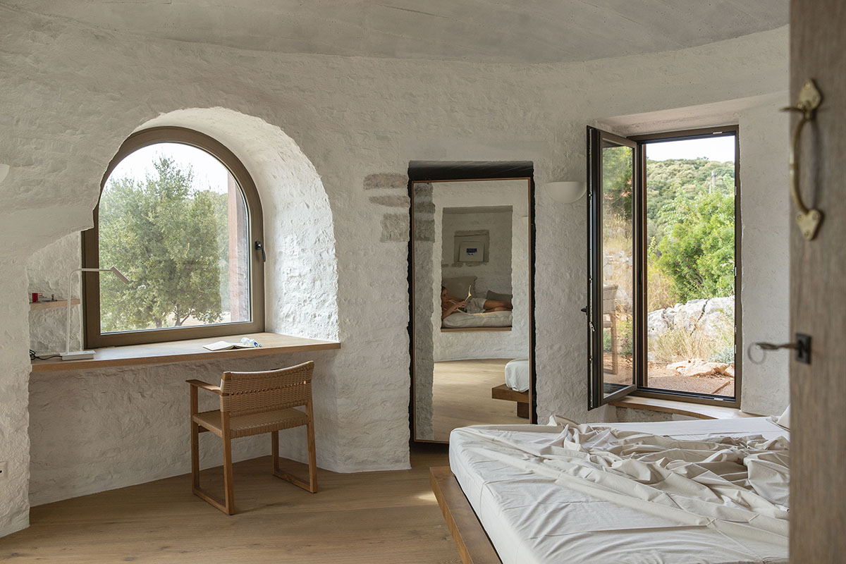 Pastoral round stone dwellings inform Meganisi House by Hiboux Architecture on Meganisi island