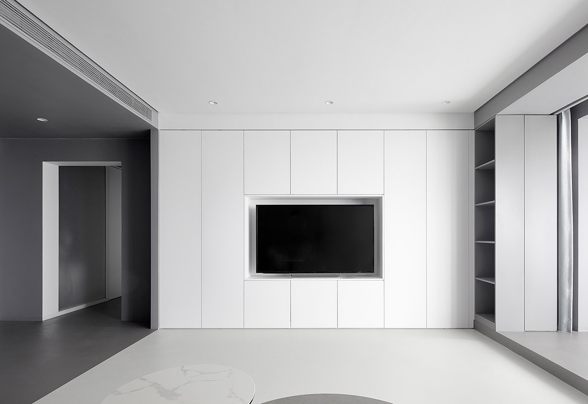XIGO STUDIO creates gray and blue-colored interiors for apartment in Beijing 