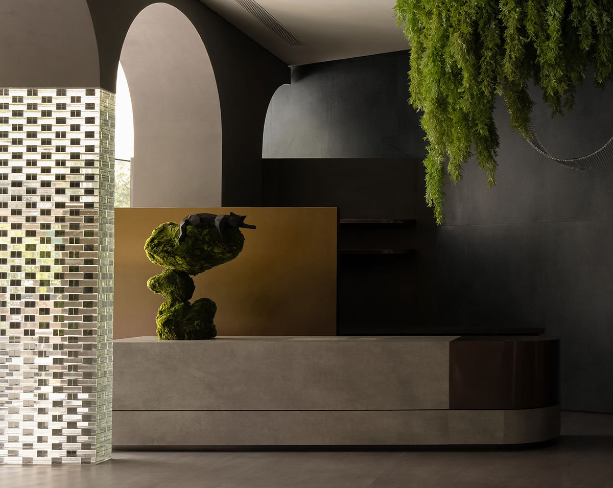 Curved walls and cave-like holes form I.T CERAMICHE Headquarters by Foshan Topway Design