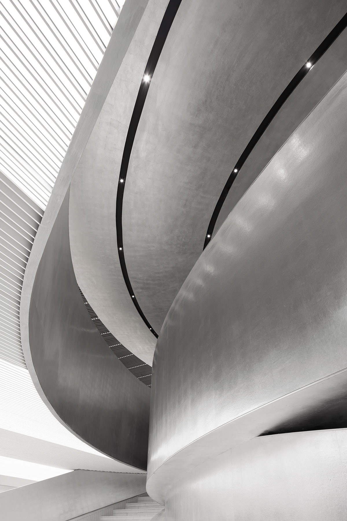 Various Associates designs beauty store with winding staircase and silver-toned interiors in Hangzhou