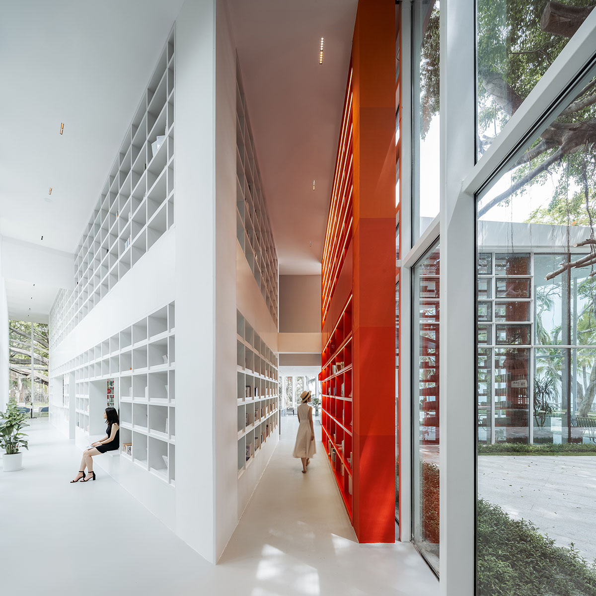 Wutopia Lab elaborates bookstore with red triangular bookshelves for Tianya Books in China 