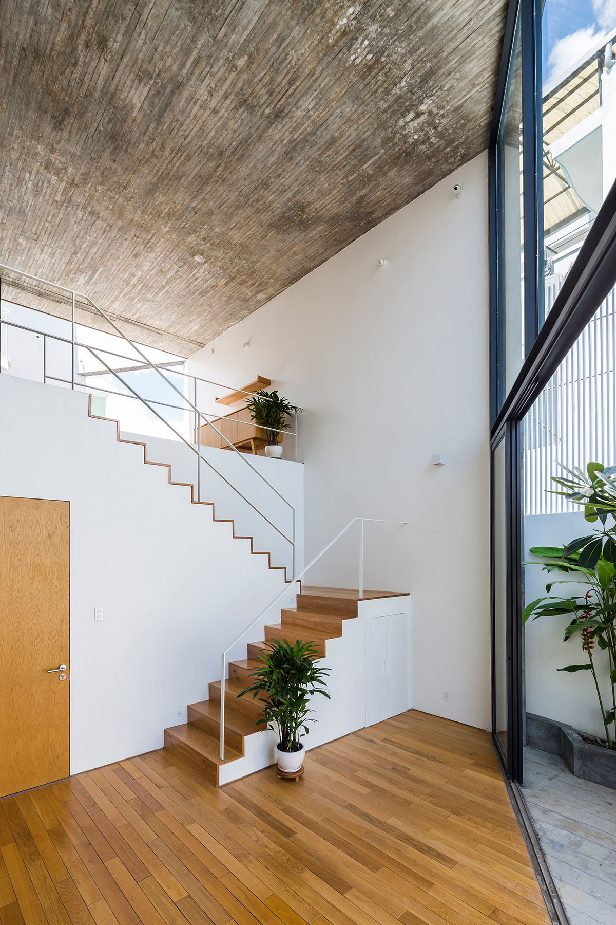 Sanuki Daisuke Architects' multifaceted concrete house features more open spaces in Vietnam