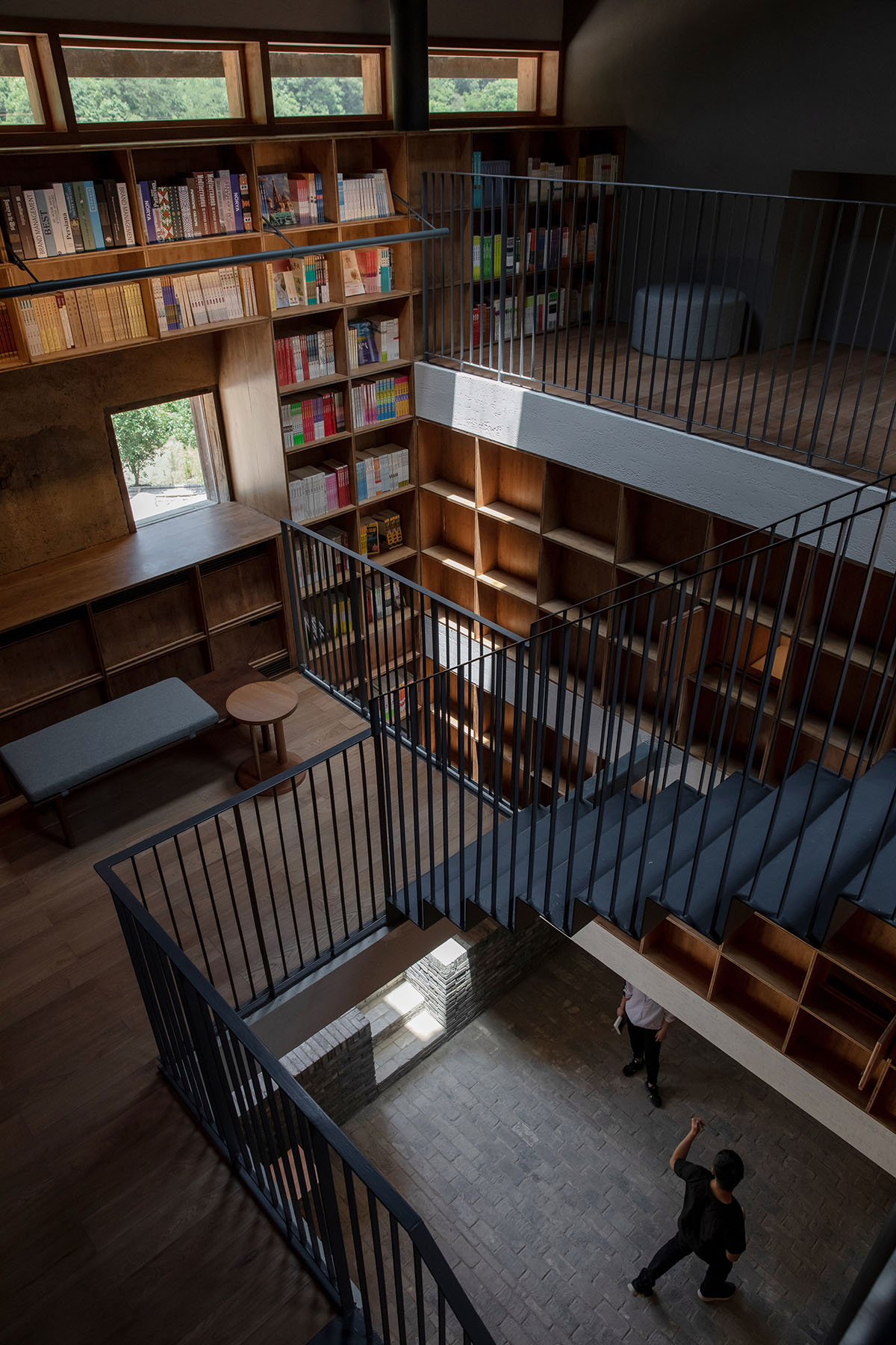 Atelier tao+c converts old building into capsule hotel with corrugated polycarbonate panels in China