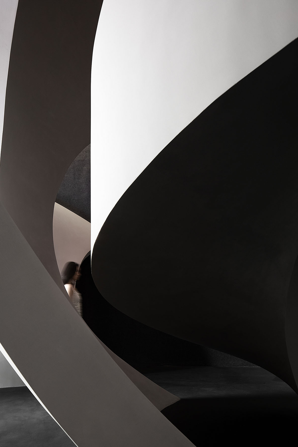 A beauty salon by AD ARCHITECTURE features dark-hued interiors drawing inspiration from cells